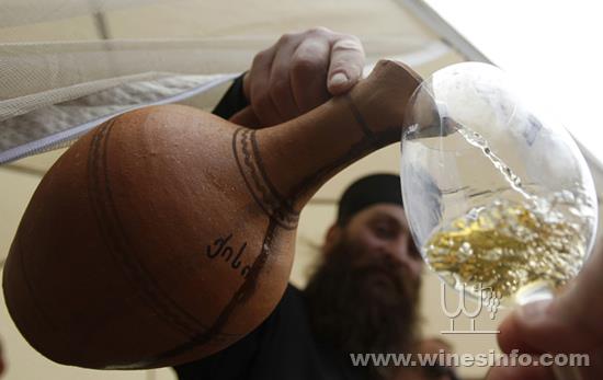 priest-pours-georgian-wine-glass.jpg